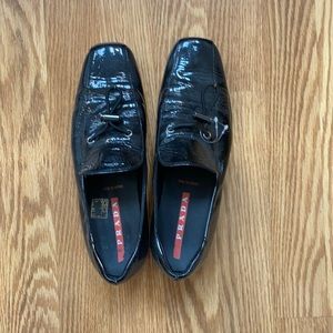 Parent black Prada loafers